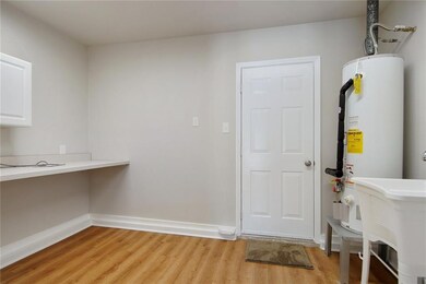 Spacious laundry room that has recently been repla