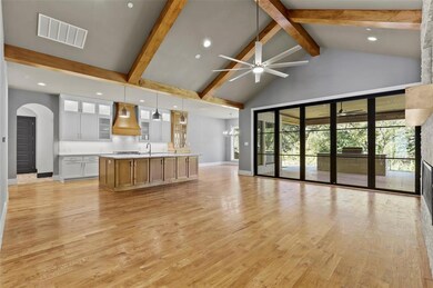 Open concept family room with views of kitchen and