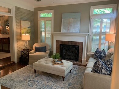 Living room featuring dark wood-type flooring, a h
