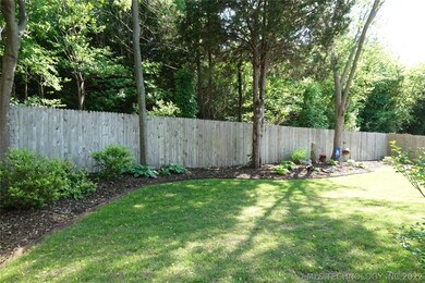 Landscaped backyard with greenbelt in rear