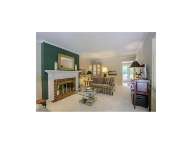 Very Airy Living Room Leads To The Sun Room.