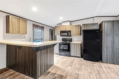 Kitchen featuring black appliances, ornamental mol