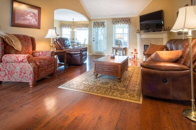 Great room opens to kitchen, sunroom and hallway leading to two bedrooms, full bathroom, laundry room and stairs to large bonus room.  This split floor plan is perfect for families or empty nesters.