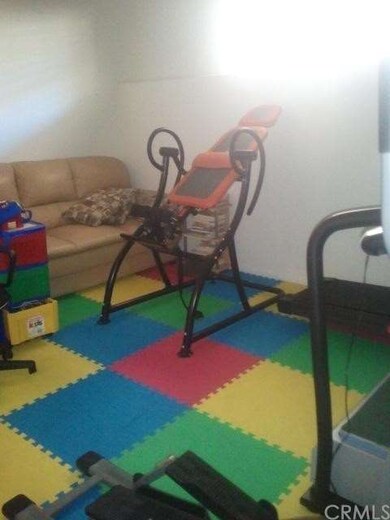first bedroom, down stairs, used as a play room/fi