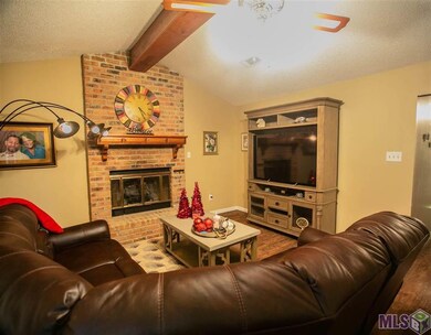 Spacious Den accentuated by a cozy fireplace!