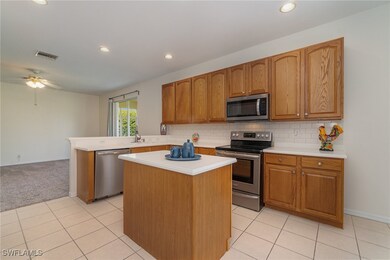 Kitchen with light tile patterned flooring, kitche