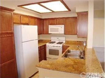 kitchen w/granite counters & maple cabinetry
