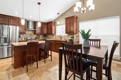 Kitchen/breakfast room has vaulted ceiling, cerami
