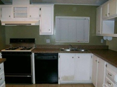 Kitchen with gas range and dishwasher.