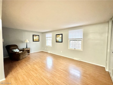 Living room with light wood-type flooring