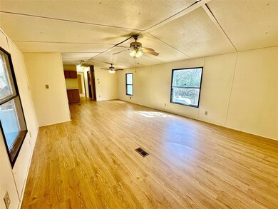 Unfurnished room with a ceiling fan, visible vent