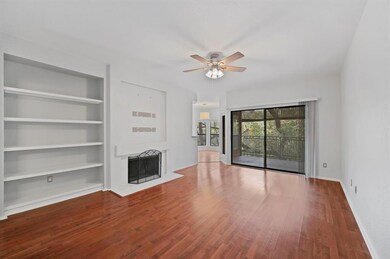Unfurnished living room with baseboards, built in