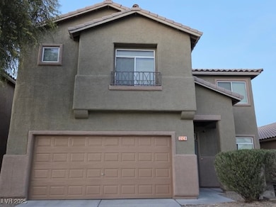 View of front of house featuring stucco siding, a tiled roof, an attached garage, and a balcony