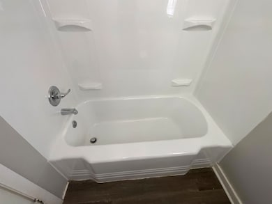 Full bathroom with shower / bath combination and w