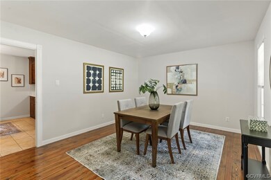 Dining room with hardwood flooring