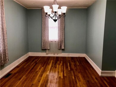 FORMAL DINING ROOM NICELY DECORATED FLOWING WITH N