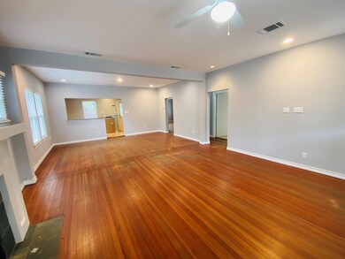 Empty room with dark wood-style floors, recessed lighting, and a ceiling fan