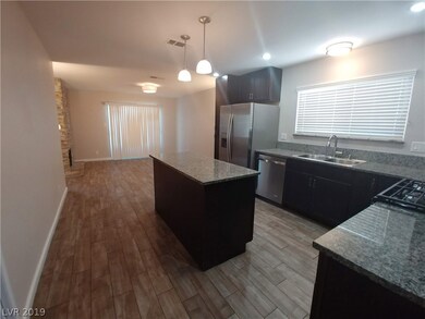 Tile floors are in the kitchen and dining area whi