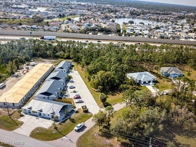 View of property location featuring nearby suburban area and a nearby body of water