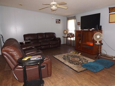 Living room with hardwood / wood-style floors, cei