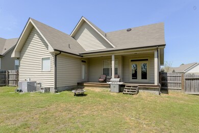 Oversized covered back porch has 2 doors leading into the home.  One in the master and one in the dining room.