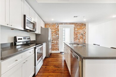 Light + bright kitchen with all stainless applianc