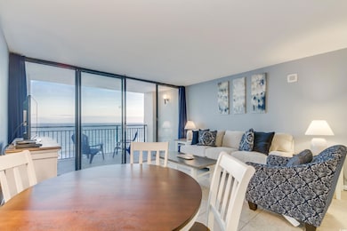 Dining area featuring floor to ceiling windows and
