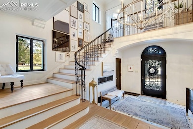 Front door and landing, stairway to upstairs