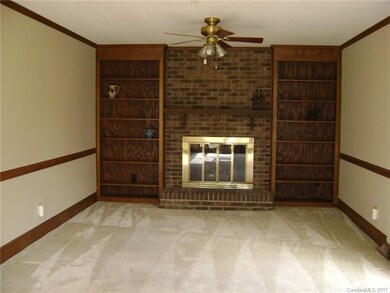 Family room features gas fireplace, built-ins and 