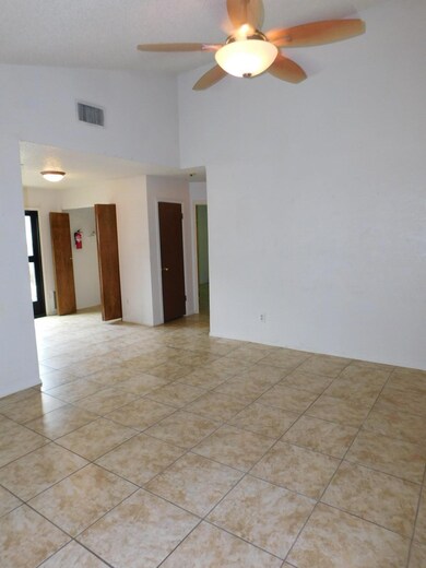 Spare room featuring a ceiling fan, visible vents