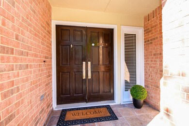 Your charming tile laid, double front door is welc