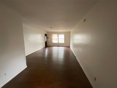 Spare room featuring dark hardwood / wood-style fl