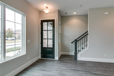10 foot ceilings on first floor! Photo is an example of builder's work. Actual home built may vary.