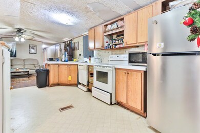 Kitchen featuring stainless steel appliances, a te
