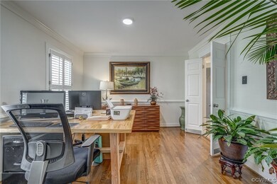 Elegant French Doors close off the kitchen and Lau