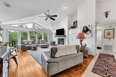 The open living area is bathed in natural light sh