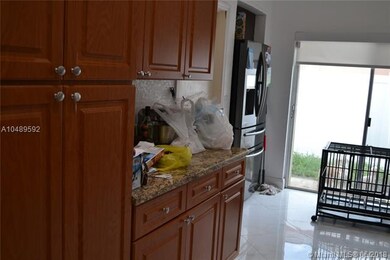 Kitchen with granite countertop and S/S appliances