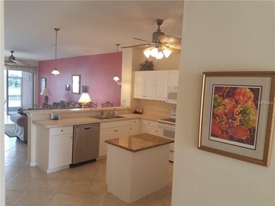 Center island with granite countertop provides add