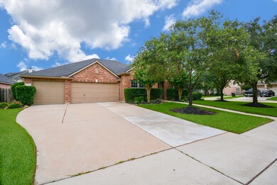 This home has a massive driveway which is good for a large family, having a party or for a nice game of pickle ball.