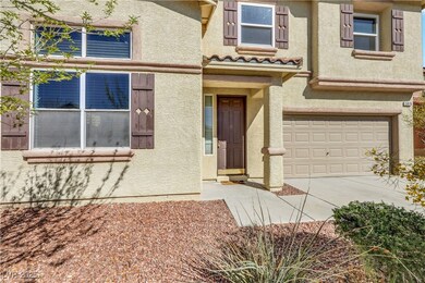 Entrance to property featuring concrete driveway,