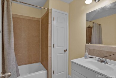 Bathroom with vanity and shower / tub combo