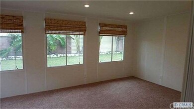 Recessed lighting grace the family/bonus room