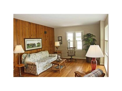 Living Room. Beautiful hardwood floors, large pict