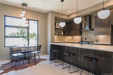 Representative photo of similar house plan kitchen & breakfast nook (different finish package)