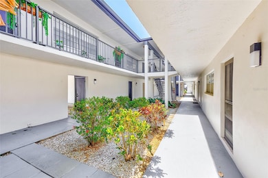 Courtyard between carport/storage and condo building