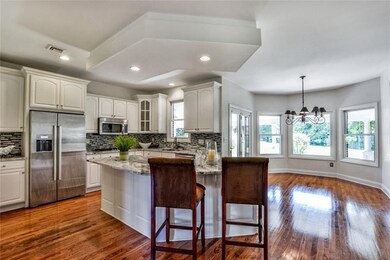 Outstanding kitchen offers a huge center island fo