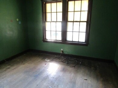 Unfurnished room with hardwood / wood-style floors