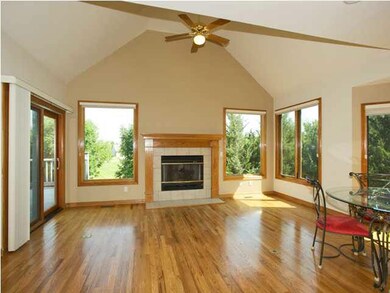 Family Room off kitchen with vaulted ceiling and f