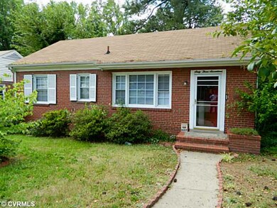 Exterior Front - All brick with sidewalk and parking in front of the home.