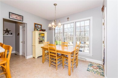 A DELIGHTFUL BREAKFAST ROOM HAS VIEWS OUT TO THE S